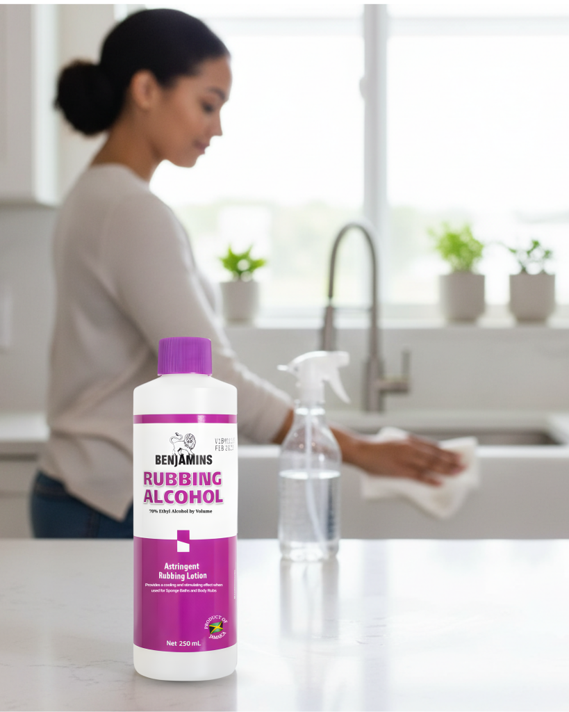 Woman cleaning her kitchen with Benjamins 70% Ethyl Rubbing Alcohol.